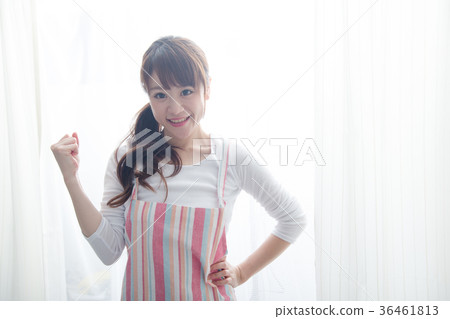 A woman in an apron 36461813