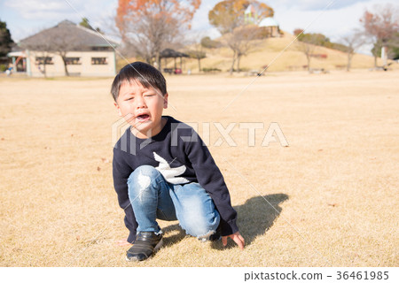 A boy crying at the park 36461985