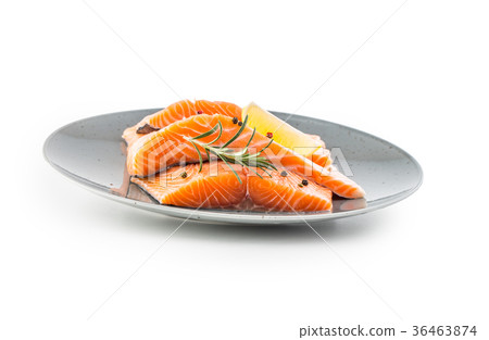 Raw salmon steaks herb peper lemon on white. 36463874