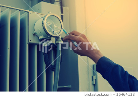 electrician checking and inspect equipment 36464138