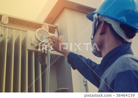 electrician checking and inspect equipment 36464139