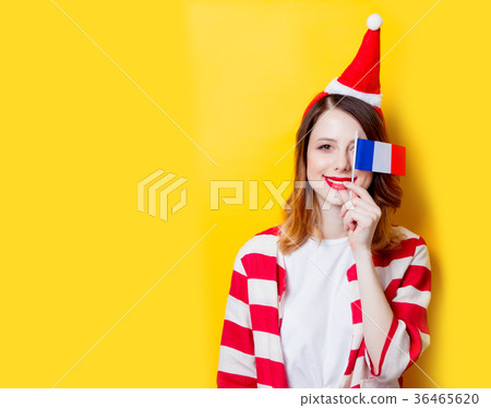 woman in Santa Claus hat with France flag woman in Santa Claus hat with France flag 36465620
