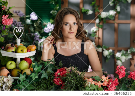 Girl in black dress in the garden 36466235