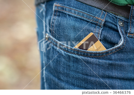 Closeup of credit card in jeans trousers pocket Closeup of credit card in jeans trousers pocket 36466376