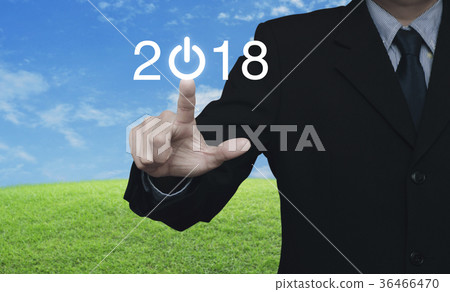 Businessman pressing 2018 start up business icon 36466470