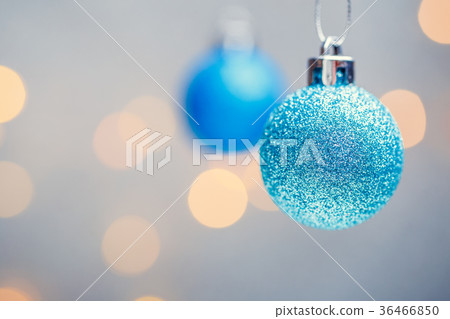 Photo of two Christmas blue balls on gray 36466850