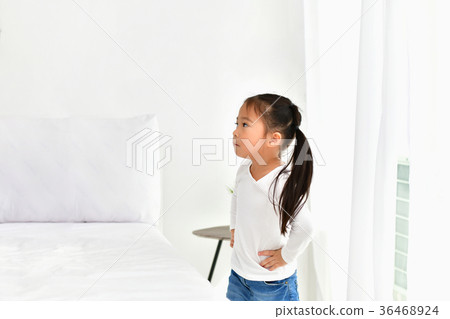 The girls are irritated in the white bedroom. 36468924