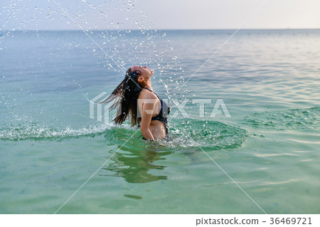 Beautiful girl in swimsuit is moving head. 36469721