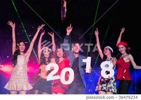 Teenagers are celebrating at the night party. 36470234