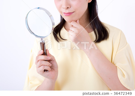 Woman, white background, magnifying glass Woman, white background, magnifying glass 36472349