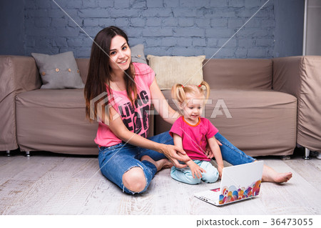caucasian mother with daughter using computer caucasian mother with daughter using computer 36473055