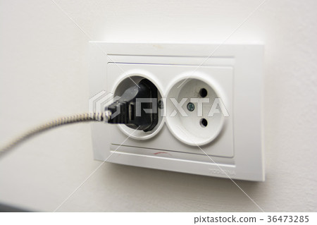 Close up plug in the socket 36473285