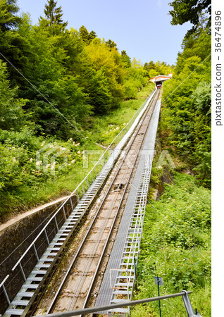 View of the rails of a funicular in the mountains View of the rails of a funicular in the mountains 36474896
