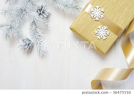 Mockup Christmas gift gold bow and tree cone 36475550