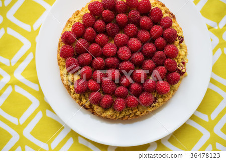 bright crimson-sand cake on yellow napkin, top 36478123
