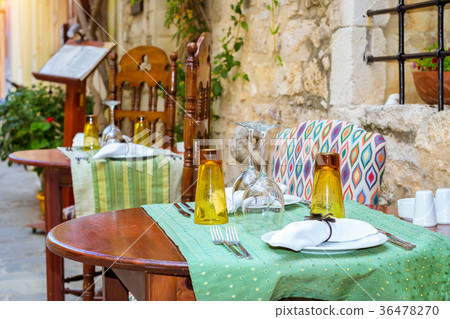 Served table in restaurant, Rethymno, Crete Greece Served table in restaurant, Rethymno, Crete Greece 36478270