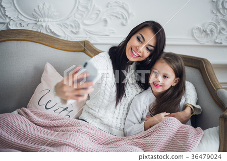 Well-groomed hand of a woman holding a phone 36479024