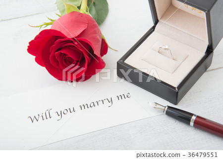 propose message with diamond ring and rose 36479551