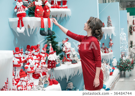 customer girl choosing gifts for Christmas and New 36484744
