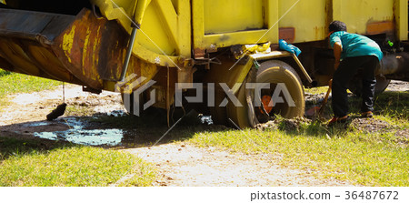 Garbage truck stuck in the mud 36487672
