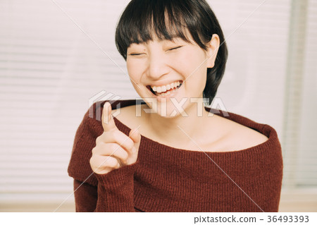 Laughing young woman facial expression 36493393