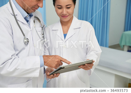 Medical workers with tablet computer 36493573