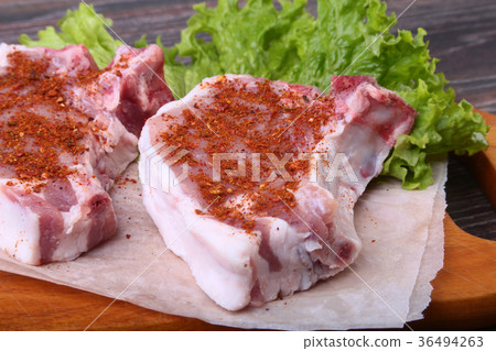 Raw pork steak with spices Leaves lettuc 36494263