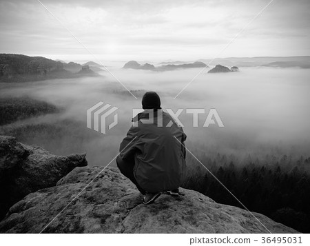 Hiker on the rocky peak. Wonderful daybreak Hiker on the rocky peak. Wonderful daybreak 36495031