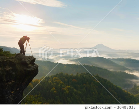 Nature photographer in the action. Man silhouette Nature photographer in the action. Man silhouette 36495033