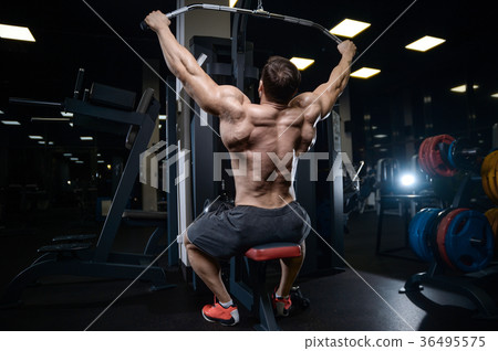 Brutal strong bodybuilder athletic men pumping up muscles with d Brutal strong bodybuilder athletic men pumping up muscles with d 36495575