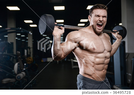 Brutal strong bodybuilder athletic men pumping up muscles with d 36495728