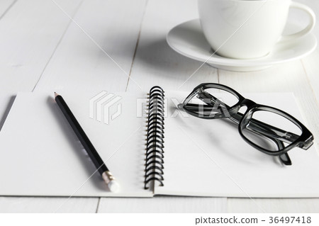 Business accessories on white wooden table Business accessories on white wooden table 36497418