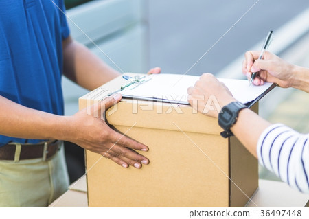 parcel delivery man Smiling postal courier   36497448