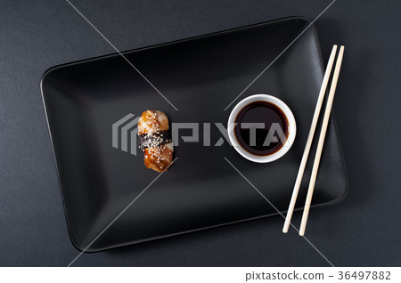 Sashimi sushi set on black plate, closeup. 36497882
