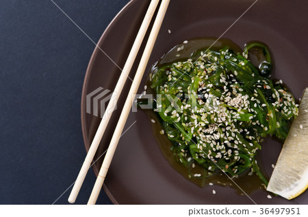 Salad Chukka from seaweed in dark ceramic plate Salad Chukka from seaweed in dark ceramic plate 36497951