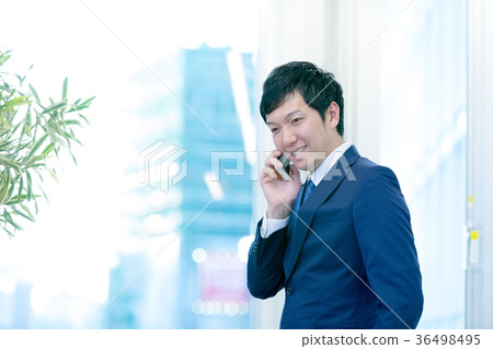 Business man making a phone call Mid-level employee Business image Project leader Consulting 36498495