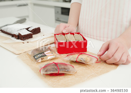A woman making sweets A woman making sweets 36498530