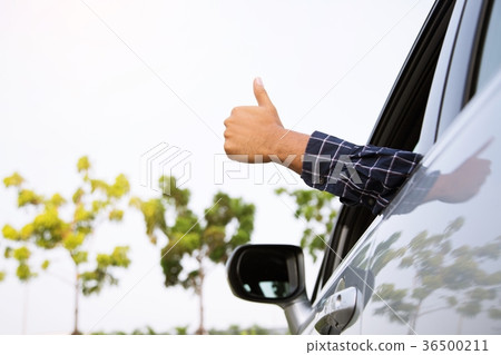 Man traveler ready to leave drive a car 36500211
