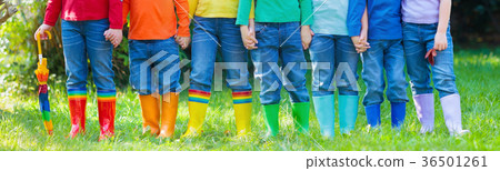 Kids in rain boots. Rubber boots for children. 36501261
