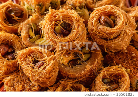 Eastern sweets on old wooden table. 36501823
