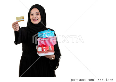 Happy young muslim woman with shopping bag and 36501876
