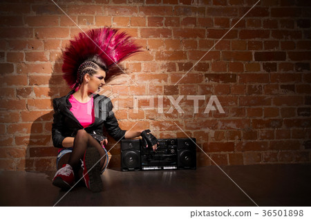 Punk girl on brick wall background Punk girl on brick wall background 36501898