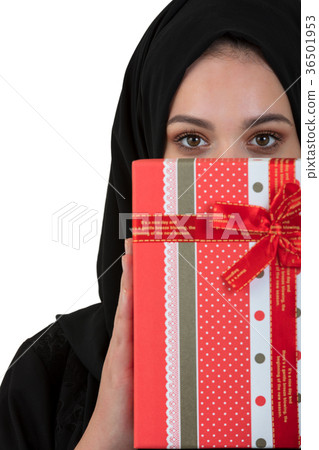 Happy young muslim woman with gift box isolated 36501953