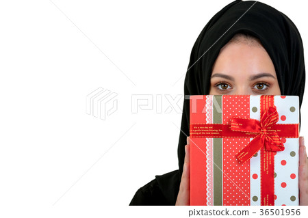 Happy young muslim woman with gift box isolated 36501956