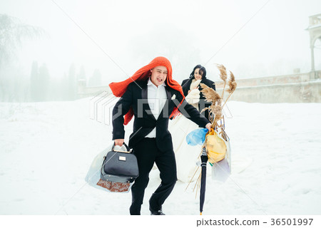 The cheerful groom with the knitted scarf on his 36501997
