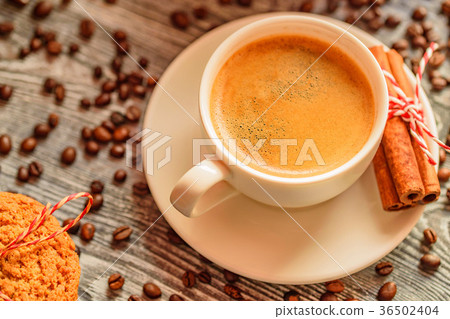 Cozy winter setting with cup of coffee Cozy winter setting with cup of coffee 36502404