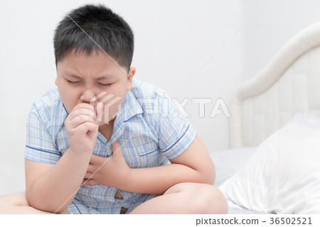 Sick obese boy is coughing and throat infection 36502521