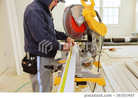 Contractor Using Circular Saw Cutting Moulding Contractor Using Circular Saw Cutting Moulding 36503497