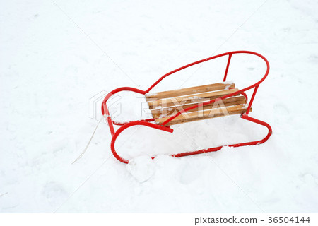 wooden sled on the snow - copy space wooden sled on the snow - copy space 36504144
