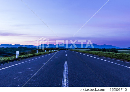 Road illuminated by the morning sun 36506740